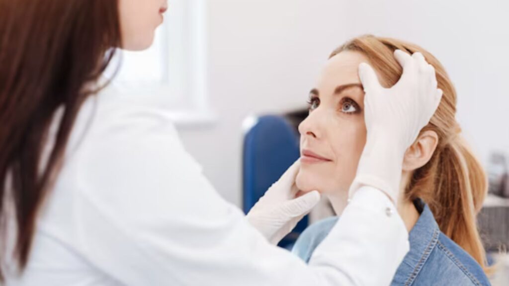 Facial Palsy Treatment Cost in Thrissur consultation with doctor examining patient face in clinic
