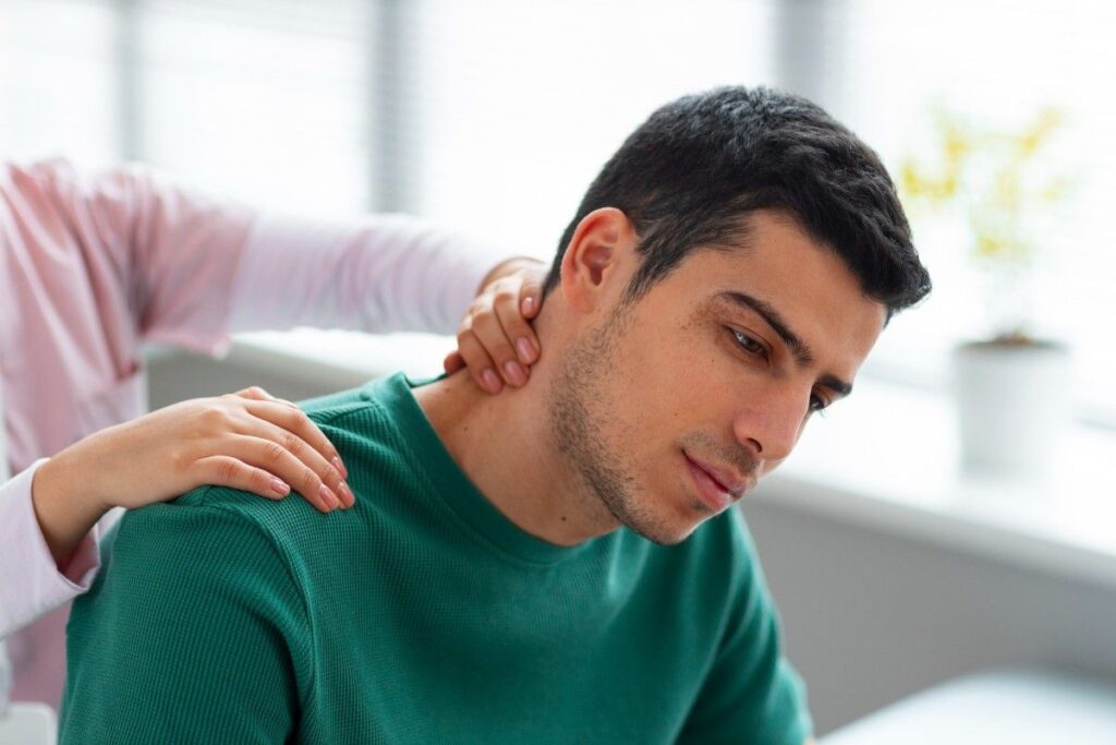 Road Accident Brachial Plexus Injury Treatment in Thrissur – patient undergoing shoulder and neck examination during rehabilitation for brachial plexus nerve injury.